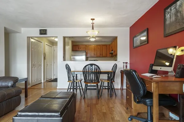 a view of a dining room with furniture and wooden floor