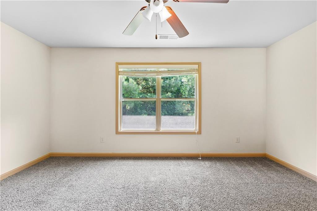 1492 Station Ridge Court Southeast Lawrenceville, GA 30045 - Photo 27 of 50 an empty room with a window