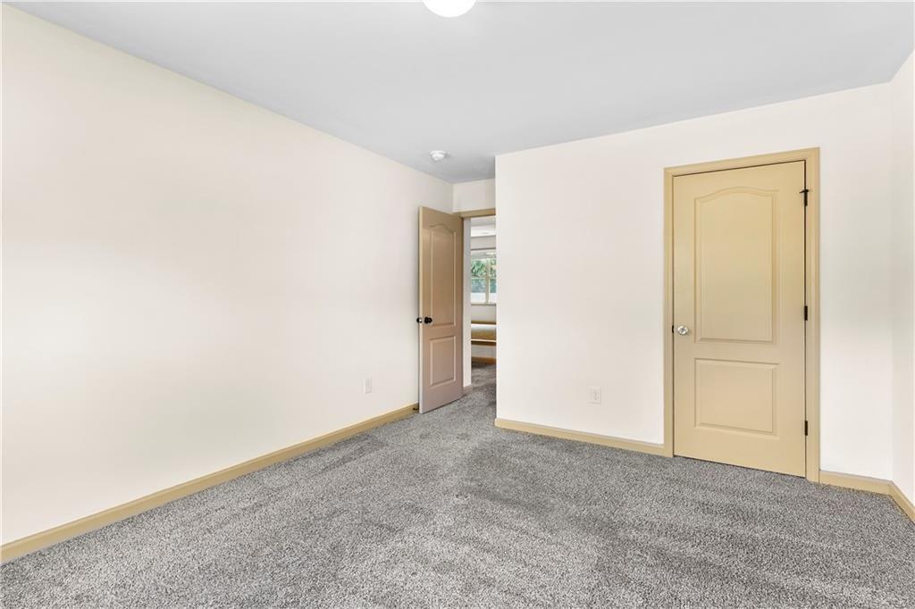 1492 Station Ridge Court Southeast Lawrenceville, GA 30045 - Photo 30 of 50 an empty room with an entryway