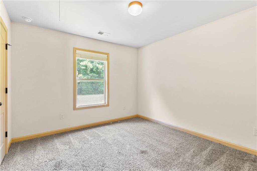 1492 Station Ridge Court Southeast Lawrenceville, GA 30045 - Photo 33 of 50 an empty room with a window