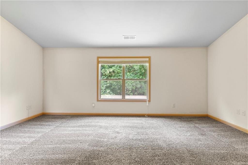 1492 Station Ridge Court Southeast Lawrenceville, GA 30045 - Photo 38 of 50 an empty room with a window