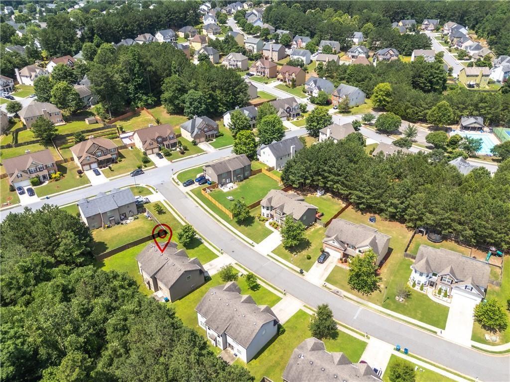 1492 Station Ridge Court Southeast Lawrenceville, GA 30045 - Photo 4 of 50 an aerial view of residential houses with outdoor space