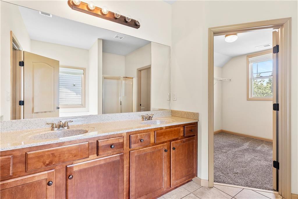 1492 Station Ridge Court Southeast Lawrenceville, GA 30045 - Photo 42 of 50 a bathroom with a sink and a mirror