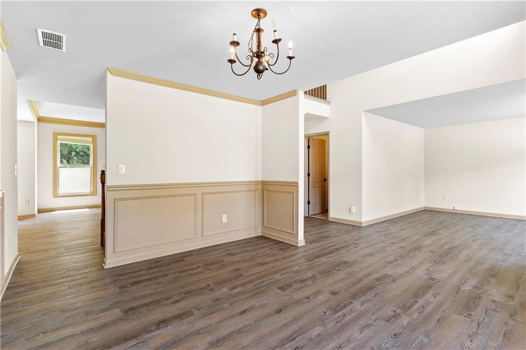 1492 Station Ridge Court Southeast Lawrenceville, GA 30045 - Photo 10 of 50 a view of a livingroom with wooden floor