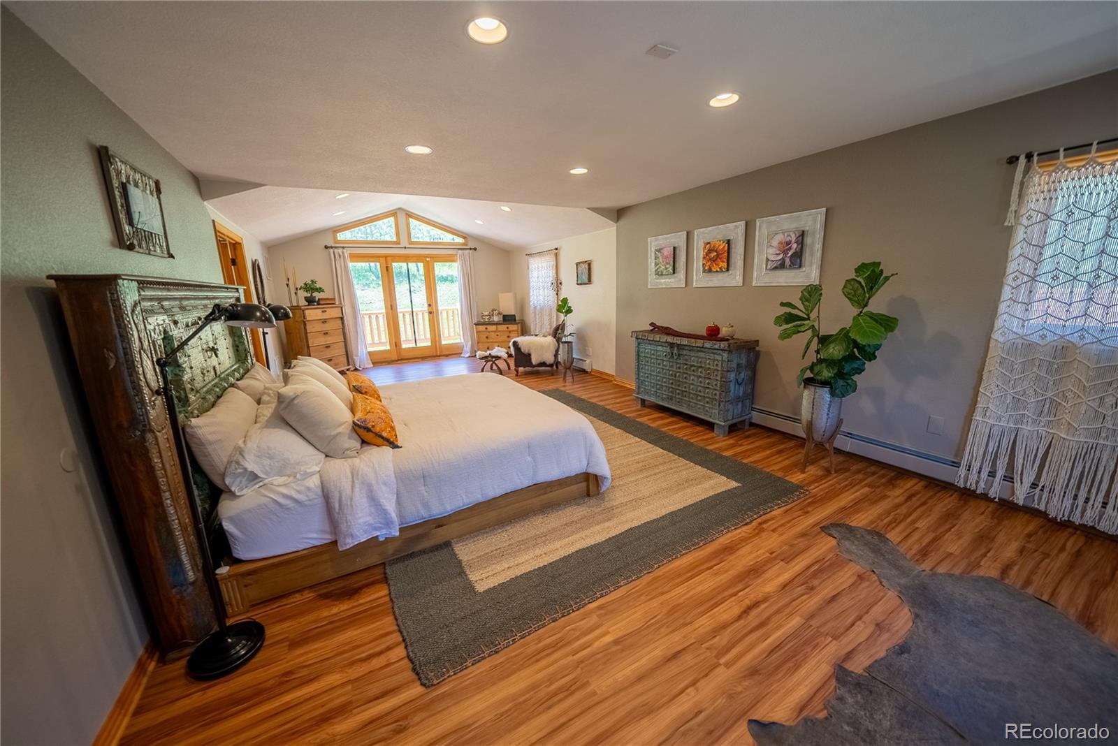 417 Witter Gulch Road Evergreen, CO 80439 - Photo 13 of 39 a bedroom with furniture and a window
