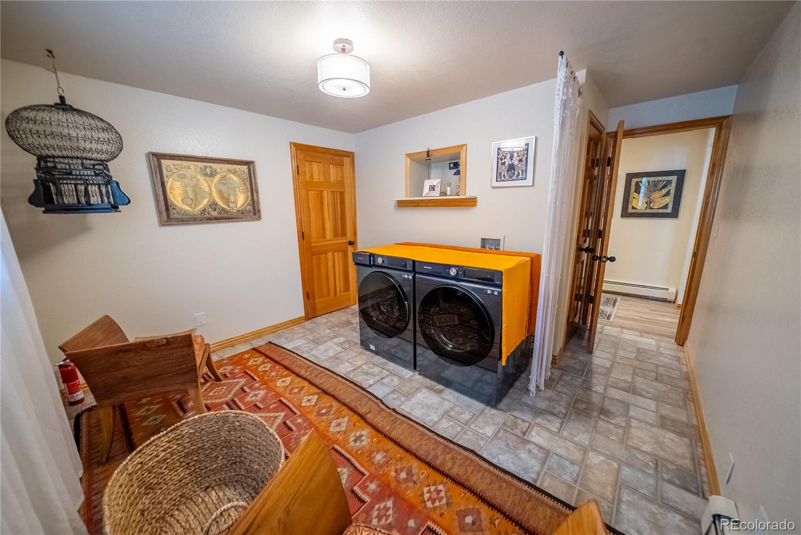 417 Witter Gulch Road Evergreen, CO 80439 - Photo 25 of 39 a living room with furniture and a fireplace