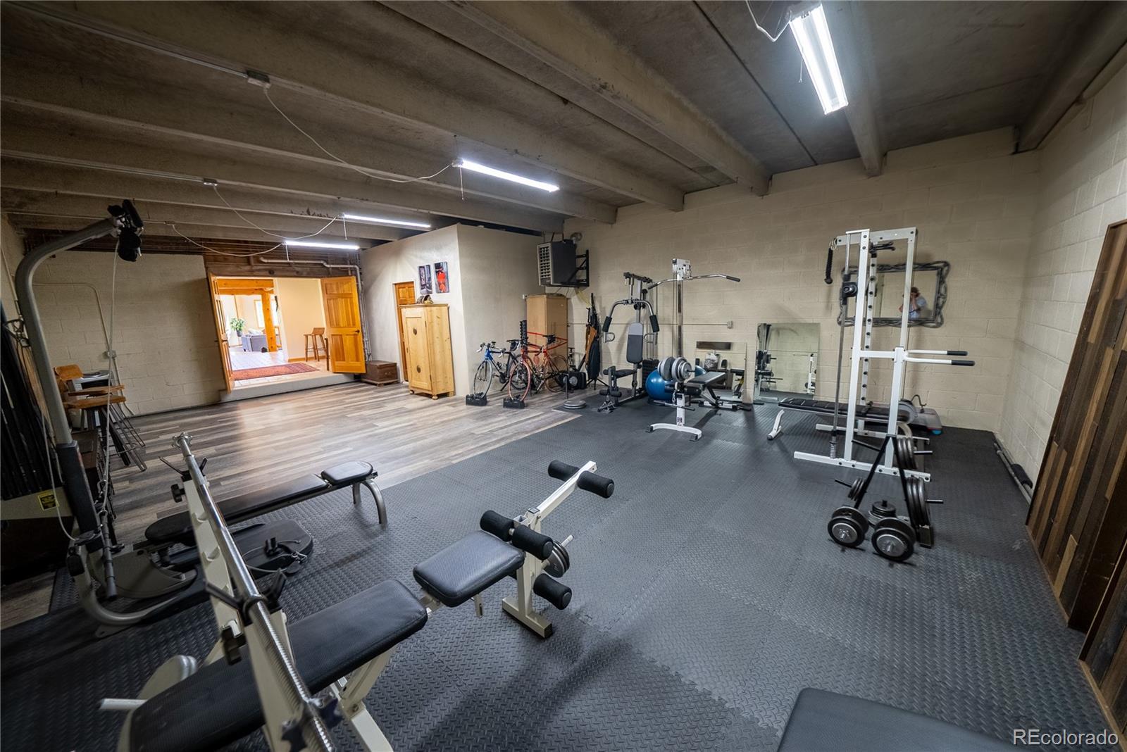 417 Witter Gulch Road Evergreen, CO 80439 - Photo 26 of 39 a gym room with gym equipment