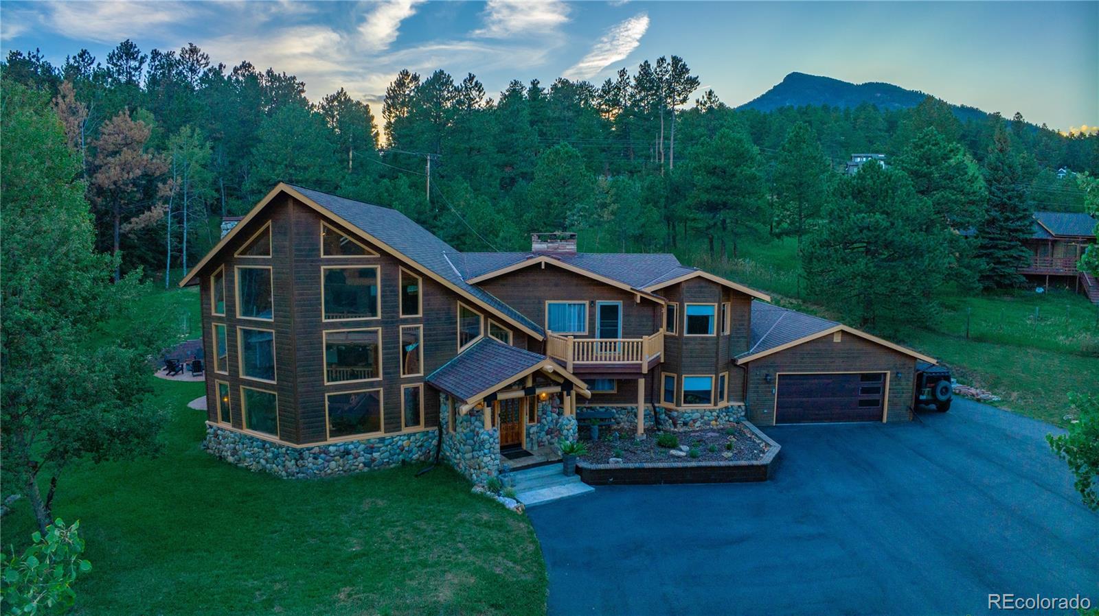 417 Witter Gulch Road Evergreen, CO 80439 - Photo 38 of 39 an aerial view of a house with roof deck front of house