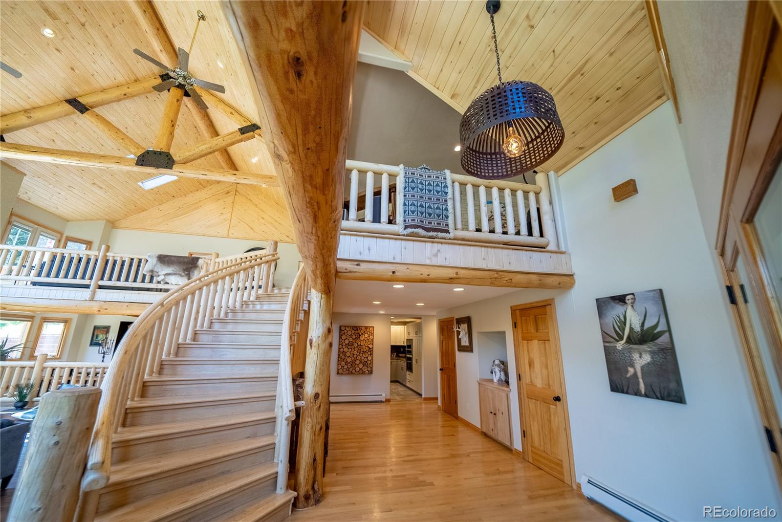 417 Witter Gulch Road Evergreen, CO 80439 - Photo 5 of 39 a view of entryway and hall with wooden floor