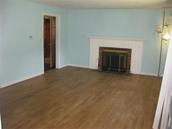 143 East Allen Ridge Road Springfield, MA 01118 - Photo 7 of 18 a view of an empty room with a fireplace