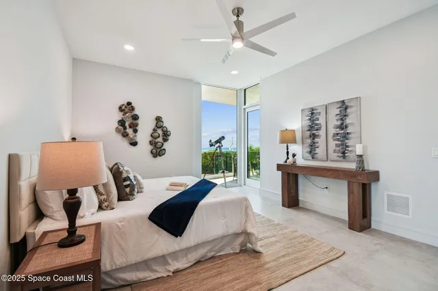 a living room with furniture a rug and a chandelier