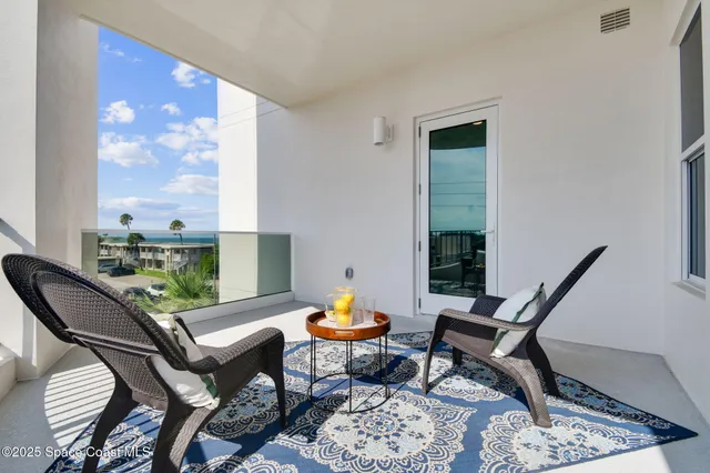 a view of a hallway with closet and door