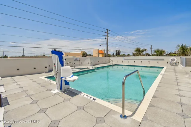 a table with wine bottles and glasses on it