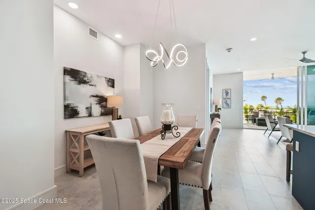 a kitchen with kitchen island granite countertop a sink a center island stainless steel appliances and cabinets