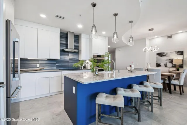 a view of living room with furniture and potted plant