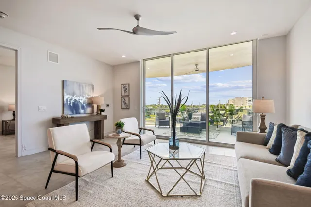 a kitchen with stainless steel appliances kitchen island granite countertop a refrigerator and a stove top oven