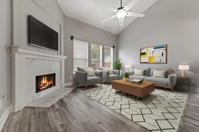 a living room with furniture fireplace and window