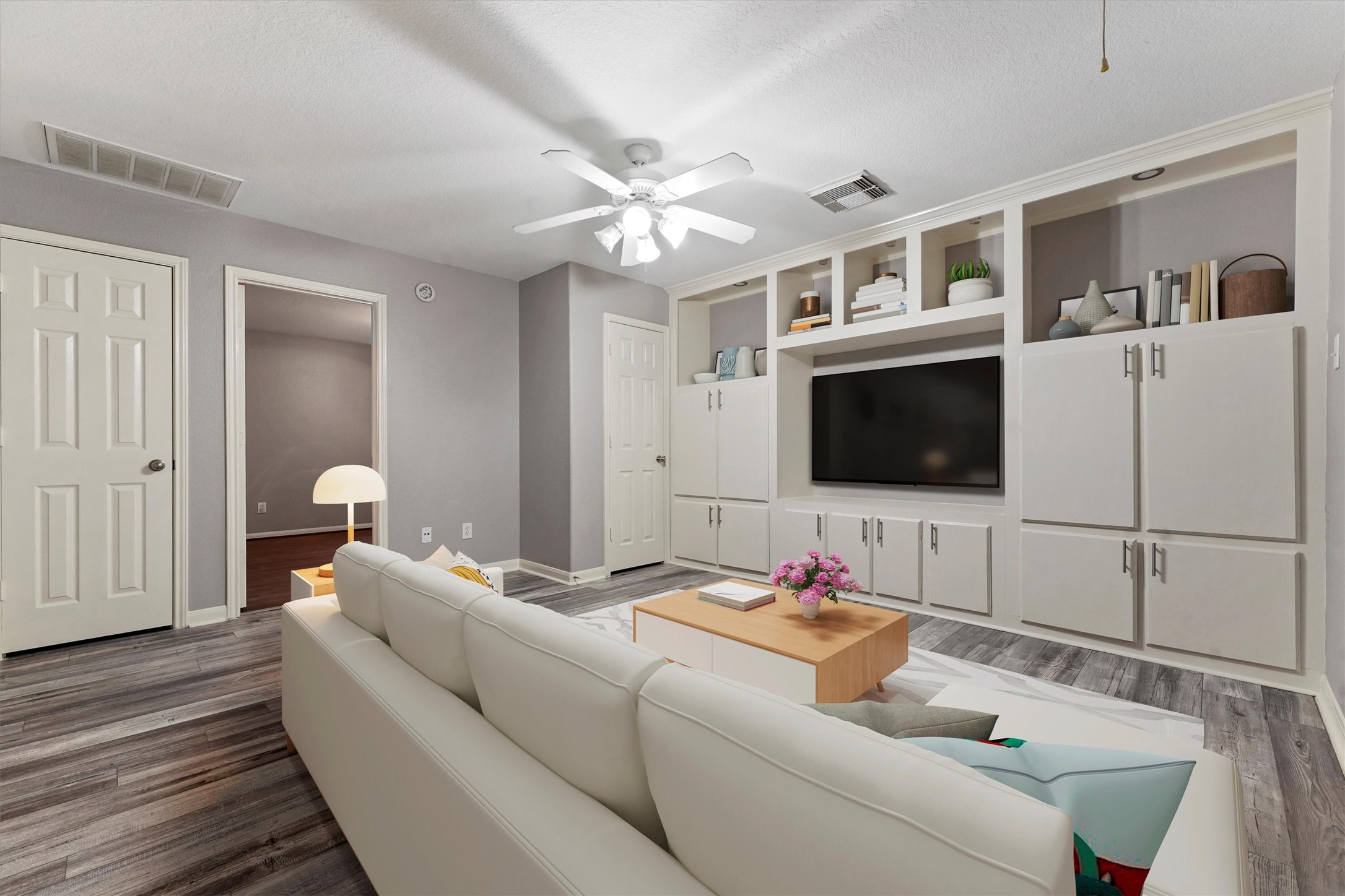 24522 Forest Path Court Spring, TX 77373 - Photo 18 of 18 a living room with furniture and a flat screen tv