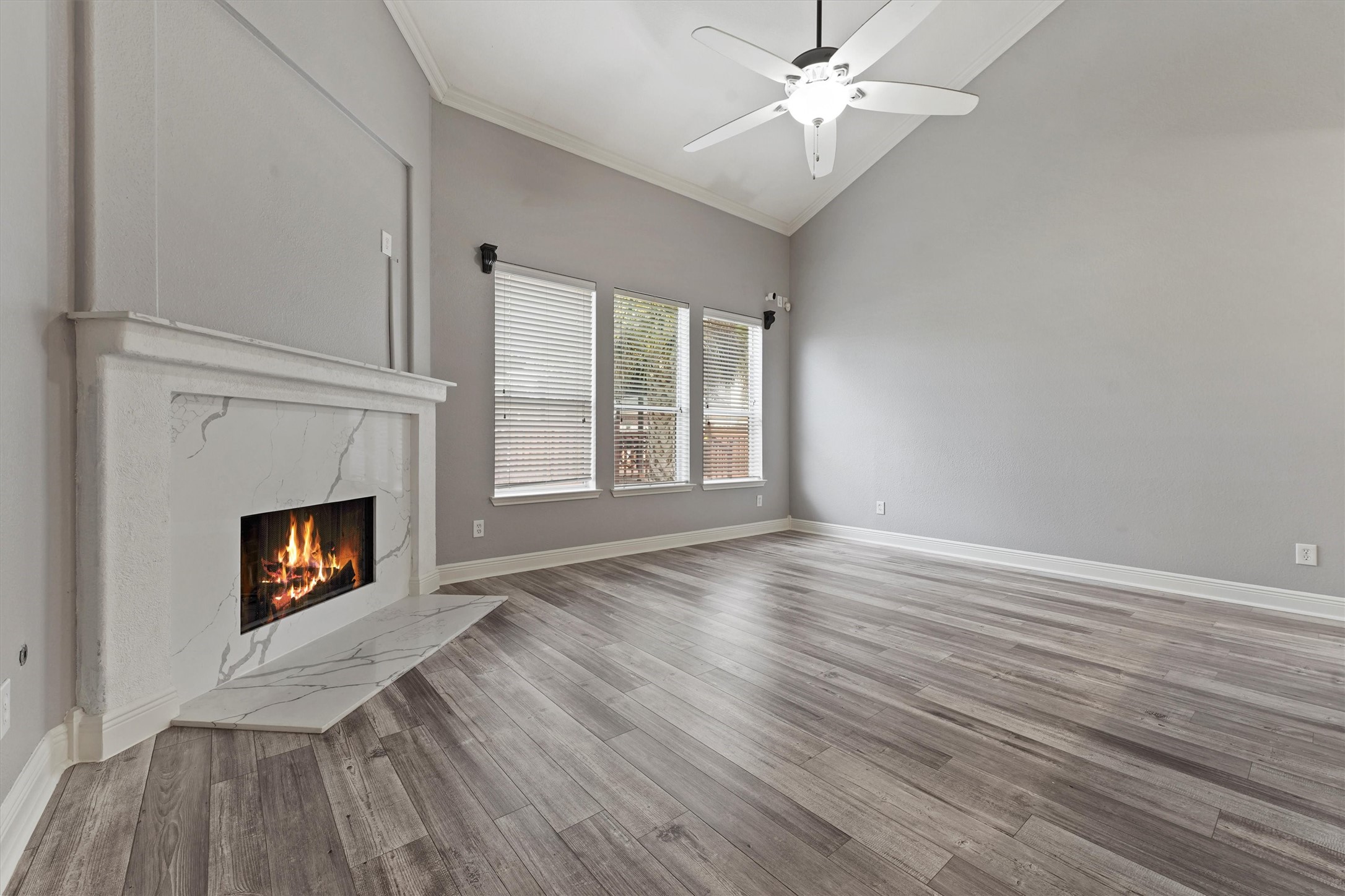 24522 Forest Path Court Spring, TX 77373 - Photo 3 of 18 wooden floor fireplace and windows in an empty room