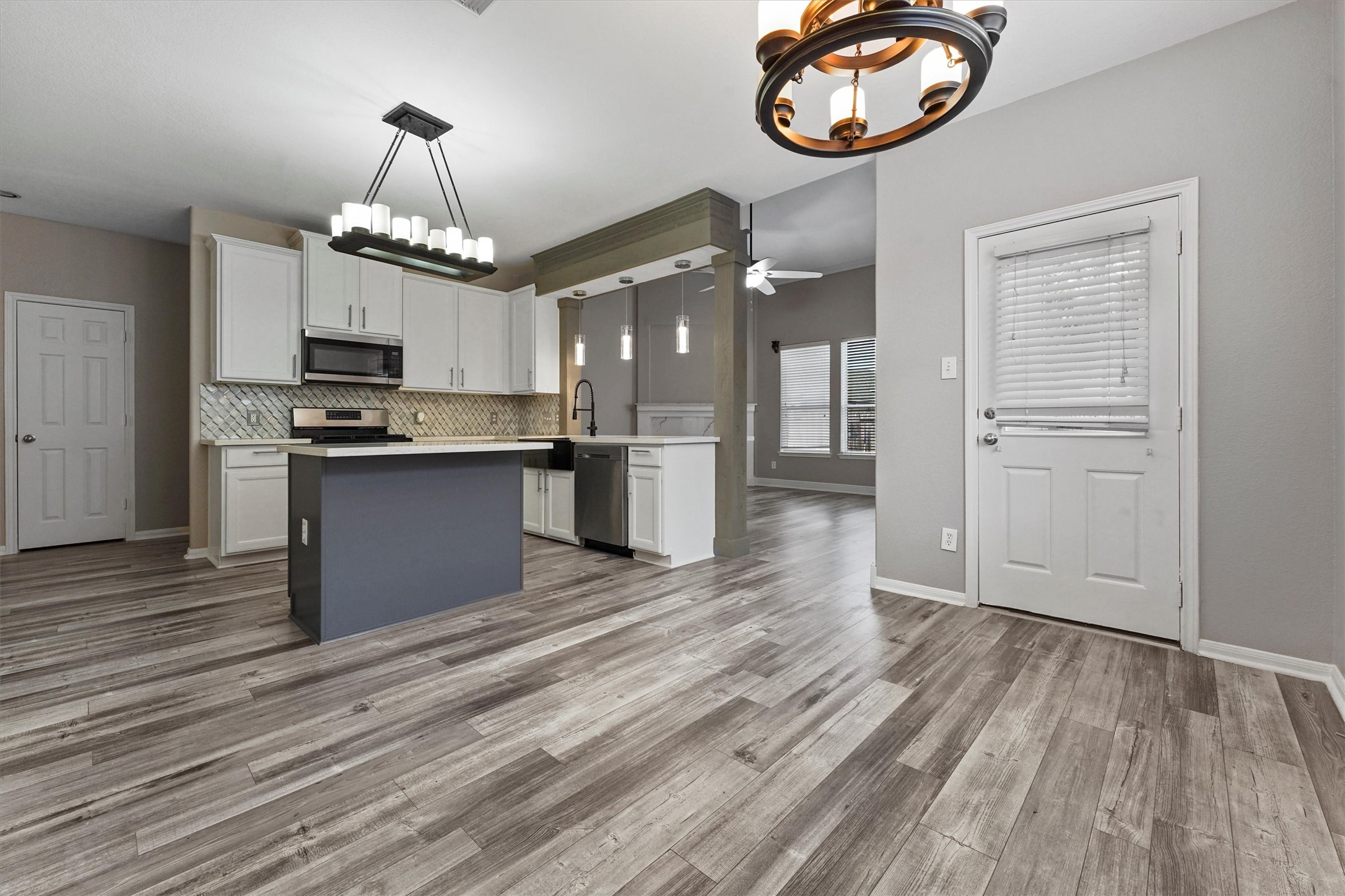 24522 Forest Path Court Spring, TX 77373 - Photo 4 of 18 a view of a kitchen with stove and cabinets