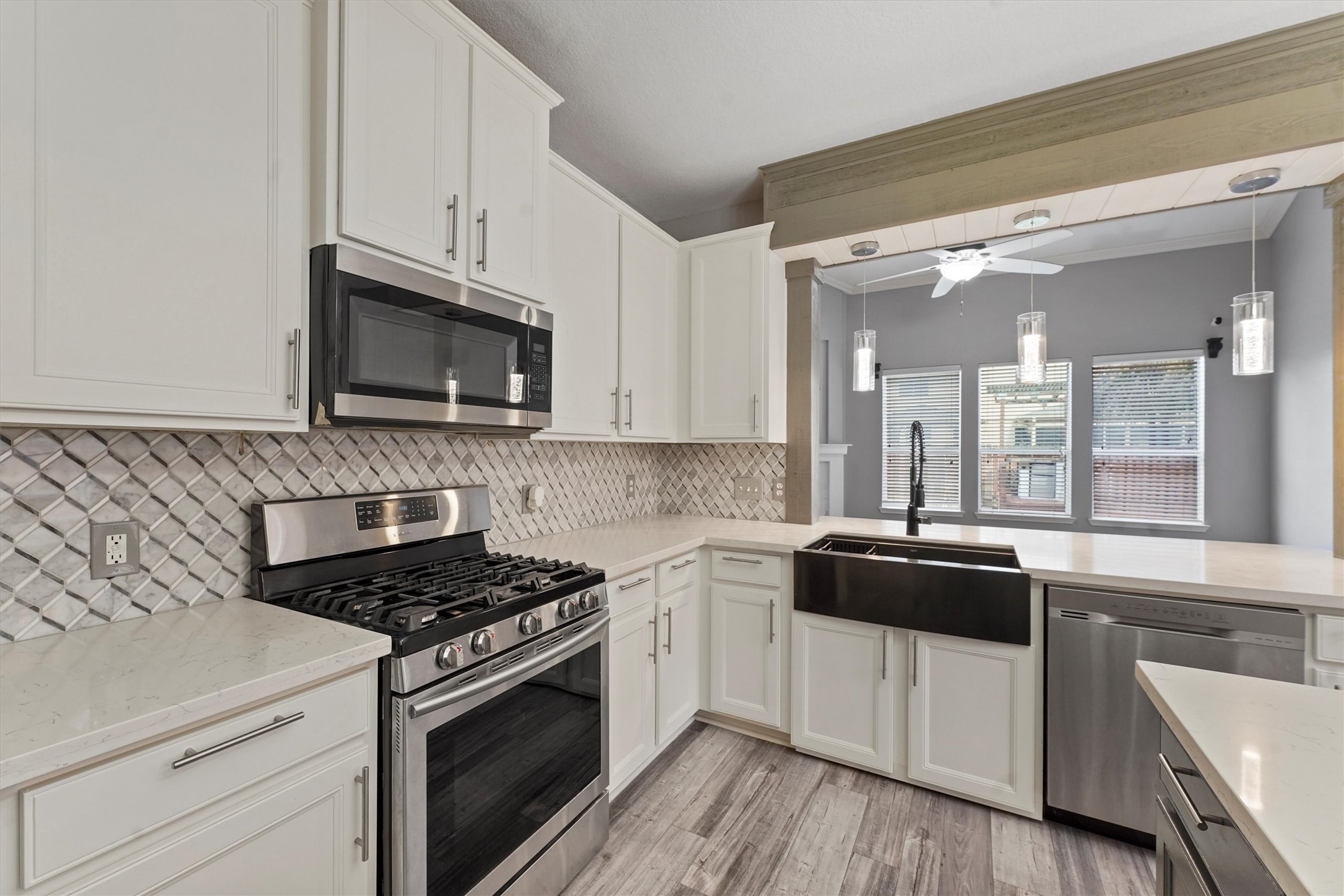 24522 Forest Path Court Spring, TX 77373 - Photo 5 of 18 a kitchen with stainless steel appliances a sink a stove and cabinets