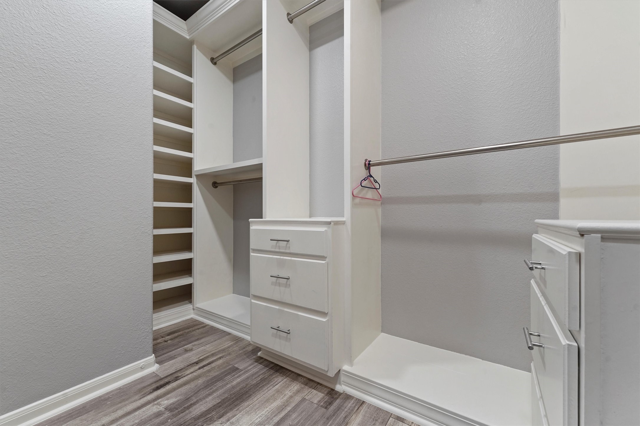24522 Forest Path Court Spring, TX 77373 - Photo 9 of 18 a view of walk in closet with empty racks