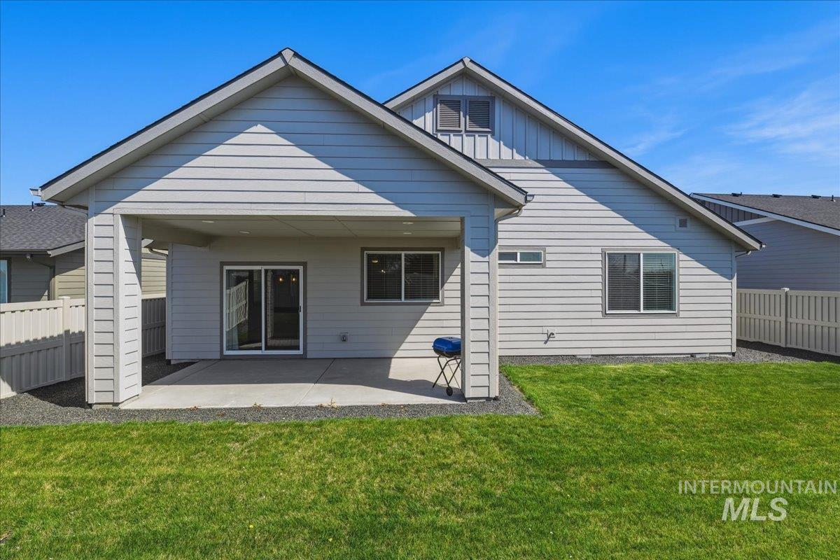 2109 North Gelding Court Middleton, ID 83644 - Photo 36 of 39 Rear view of property with a fenced backyard, a patio area, and board and batten siding