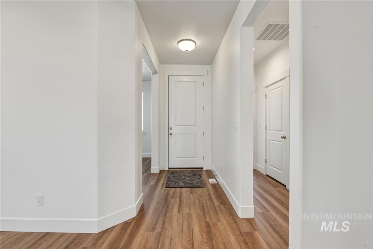 2109 North Gelding Court Middleton, ID 83644 - Photo 6 of 39 Hall featuring baseboards and wood finished floors