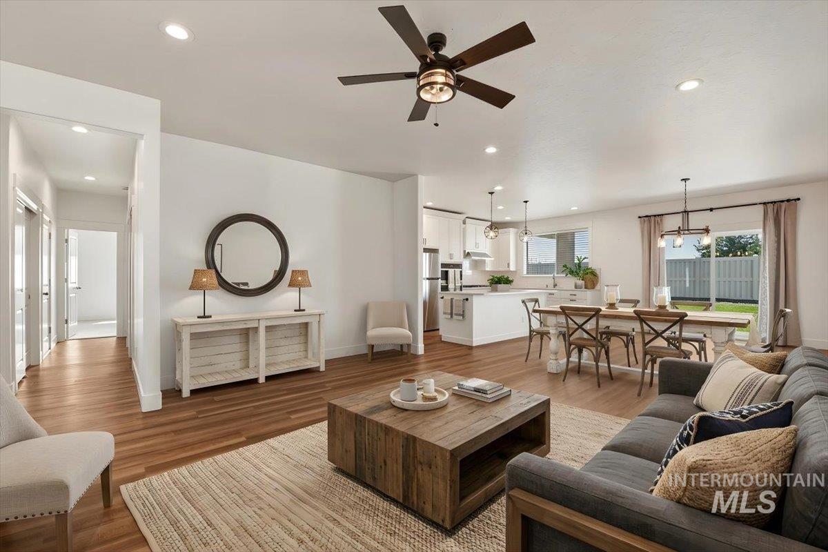 2109 North Gelding Court Middleton, ID 83644 - Photo 7 of 39 Living room with light wood-style floors, a ceiling fan, and recessed lighting