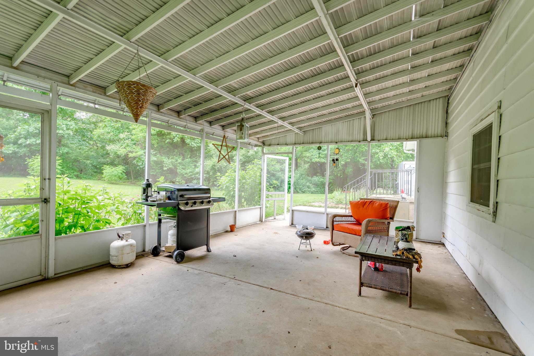 116 Blue Anchor Road Sicklerville, NJ 08081 - Photo 14 of 33 a backyard of a house with barbeque oven table and chairs