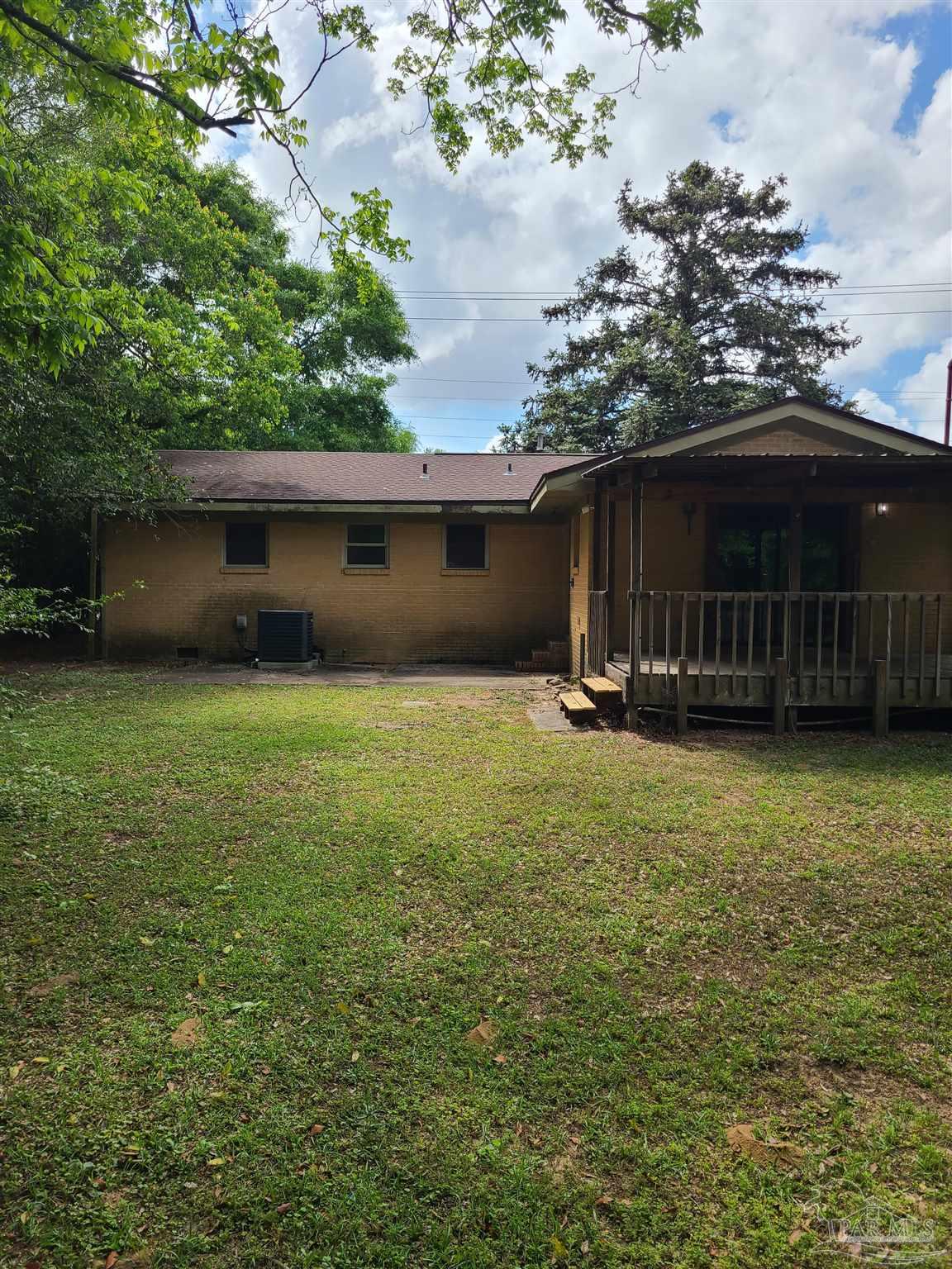 7758 Kipling Street Pensacola, FL 32514 - Photo 21 of 23 a view of a backyard with a garden