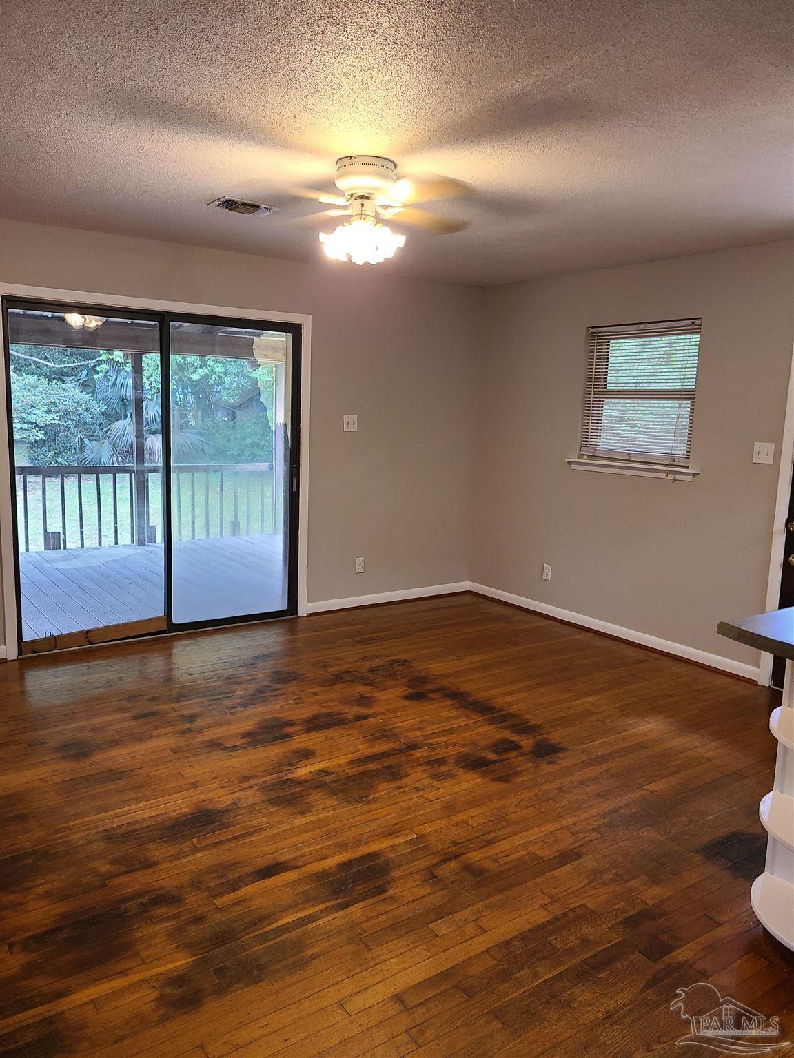 7758 Kipling Street Pensacola, FL 32514 - Photo 5 of 23 a view of an empty room with a window