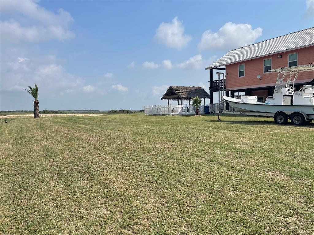904 Polk Avenue Port O'Connor, TX 77982 - Photo 37 of 40 a swimming pool with outdoor seating and yard