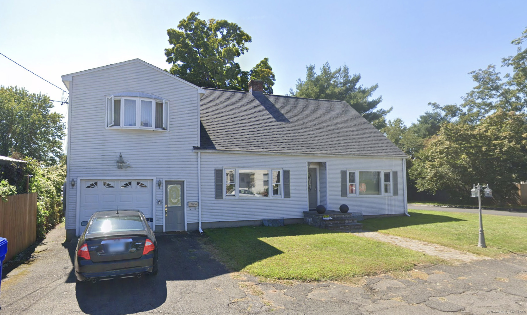 4 Commerce Street Portland, CT 06480 - Photo 1 of 1 a front view of a house with a yard