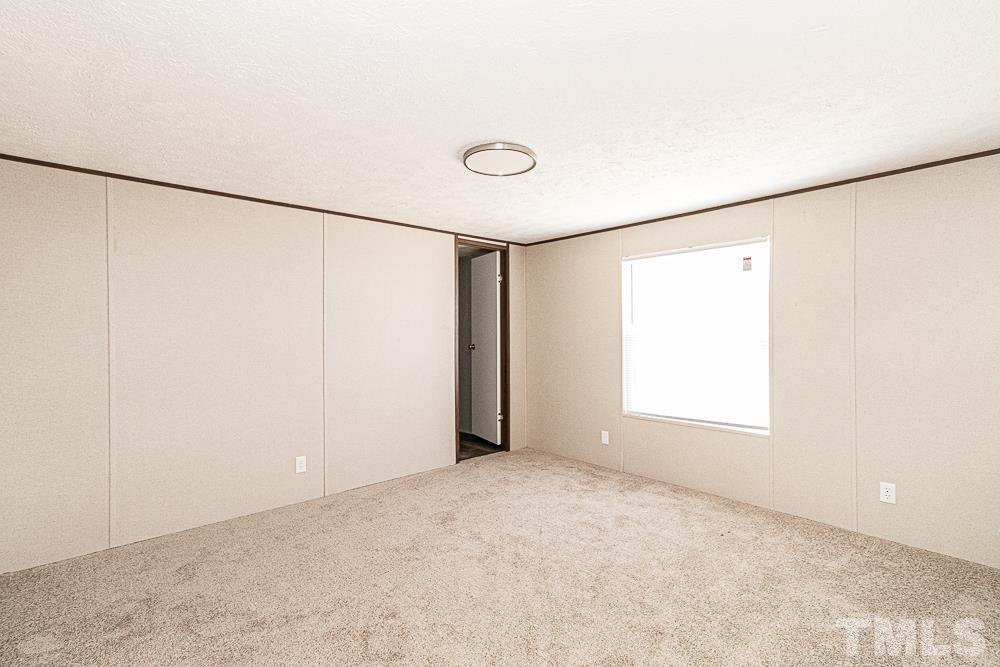 7252 Broad Leaf Dr Spring Spring Hope, NC 27882 - Photo 12 of 17 a view of an empty room with a window