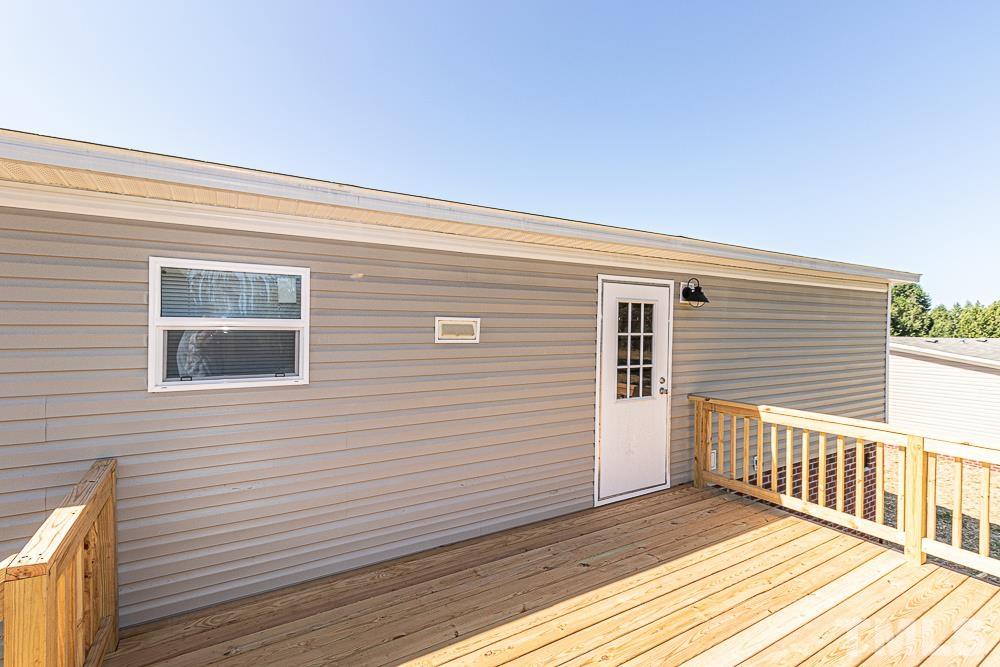 7252 Broad Leaf Dr Spring Spring Hope, NC 27882 - Photo 16 of 17 a view of a house with wooden deck