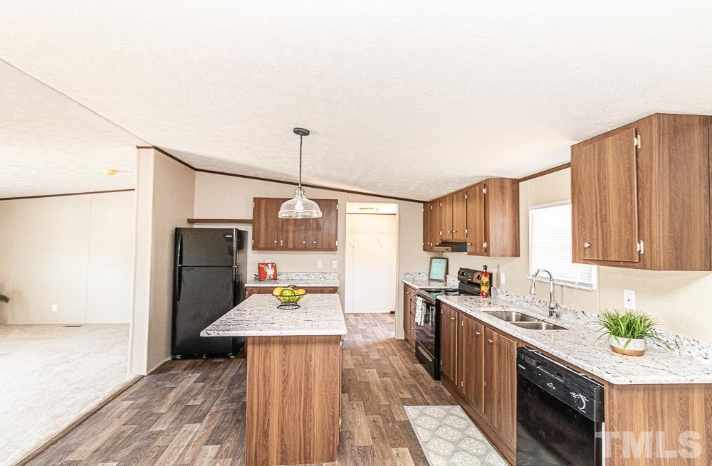 7252 Broad Leaf Dr Spring Spring Hope, NC 27882 - Photo 5 of 17 a kitchen with stainless steel appliances a sink stove and refrigerator