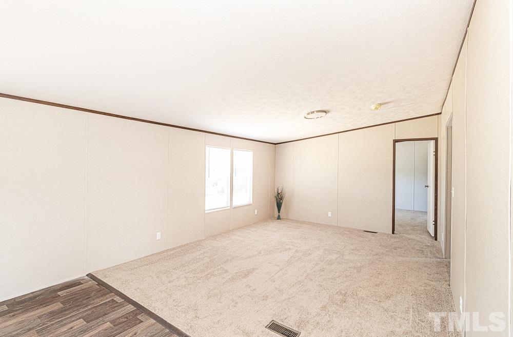 7252 Broad Leaf Dr Spring Spring Hope, NC 27882 - Photo 8 of 17 a view of an empty room with a window