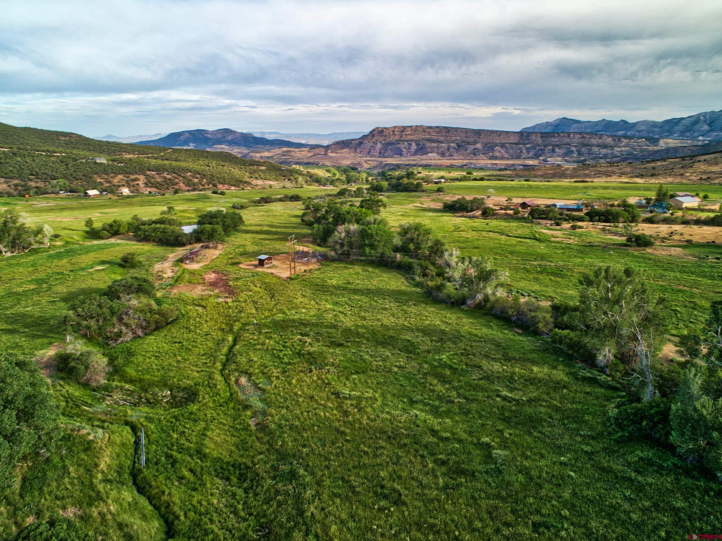 51804 KE Road Mesa, CO 81643 - Photo 1 of 29 a view of a city with mountains in the background