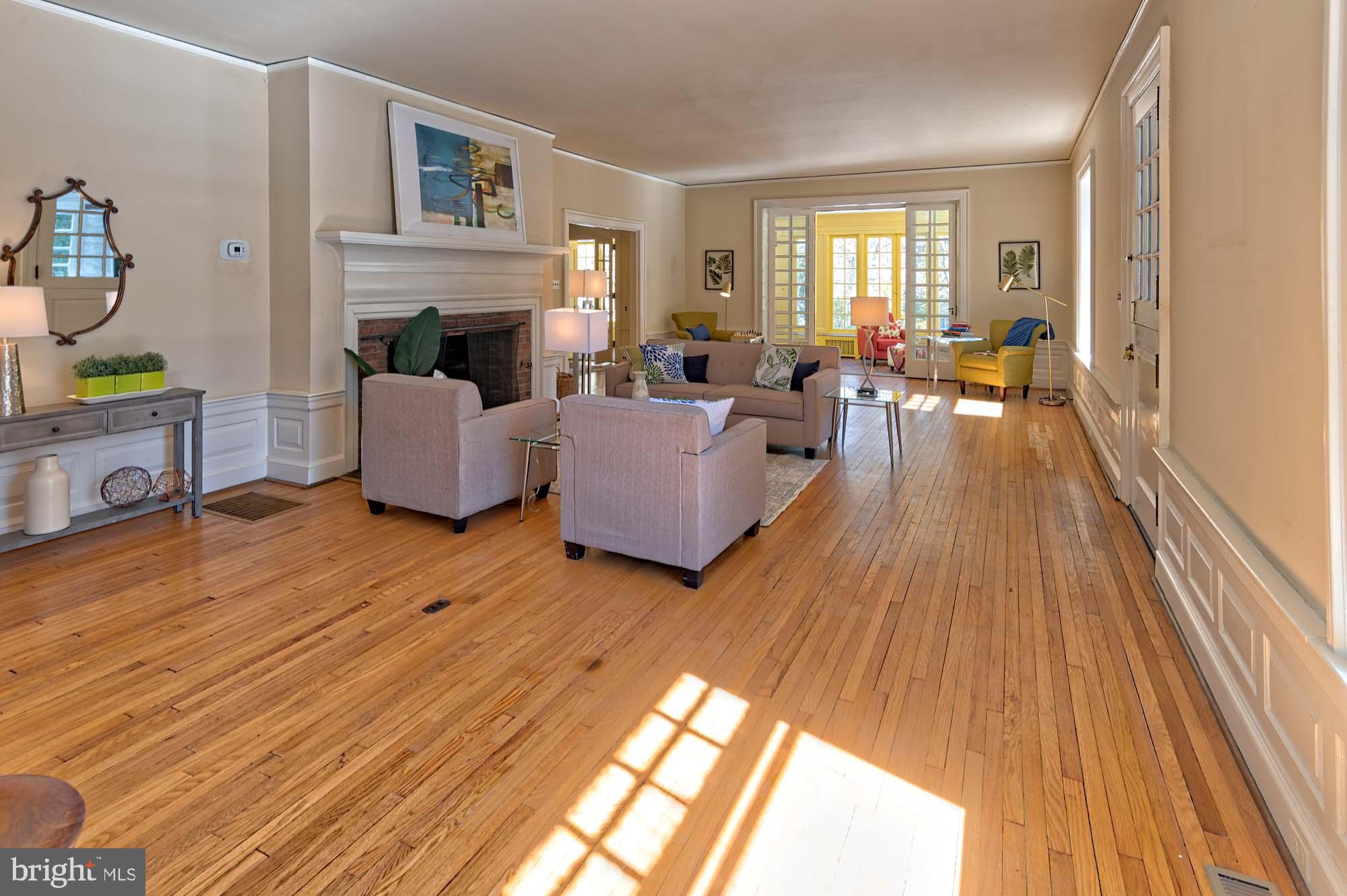 132 St Georges Road Ardmore, PA 19003 - Photo 12 of 87 a living room with furniture and a fireplace