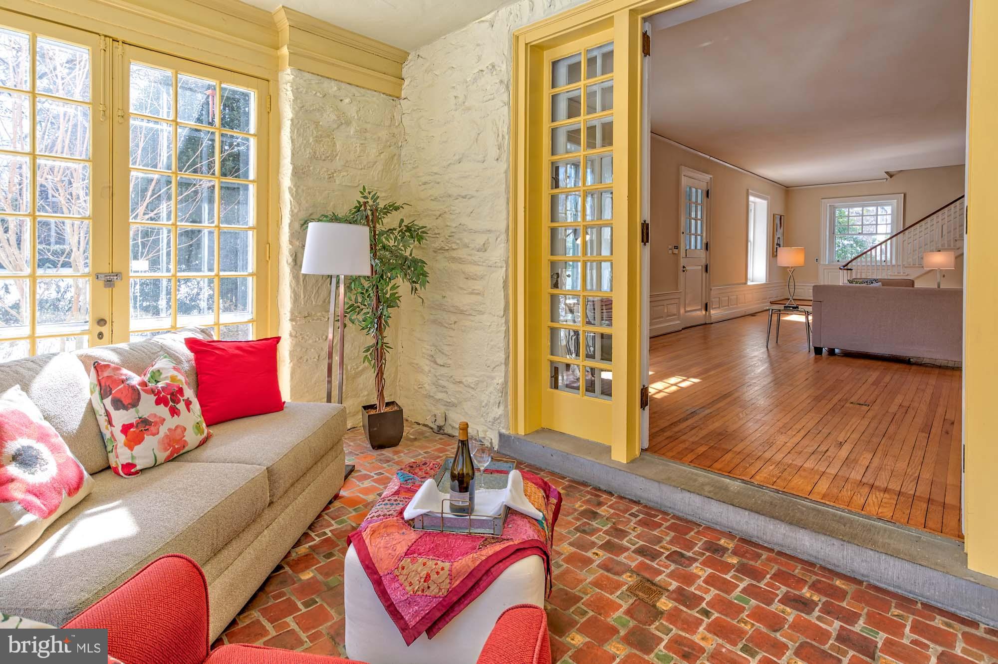 132 St Georges Road Ardmore, PA 19003 - Photo 15 of 87 a living room with furniture and a floor to ceiling window