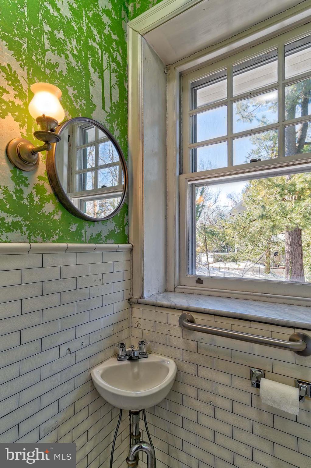 132 St Georges Road Ardmore, PA 19003 - Photo 24 of 87 a bathroom with a sink a mirror and a window