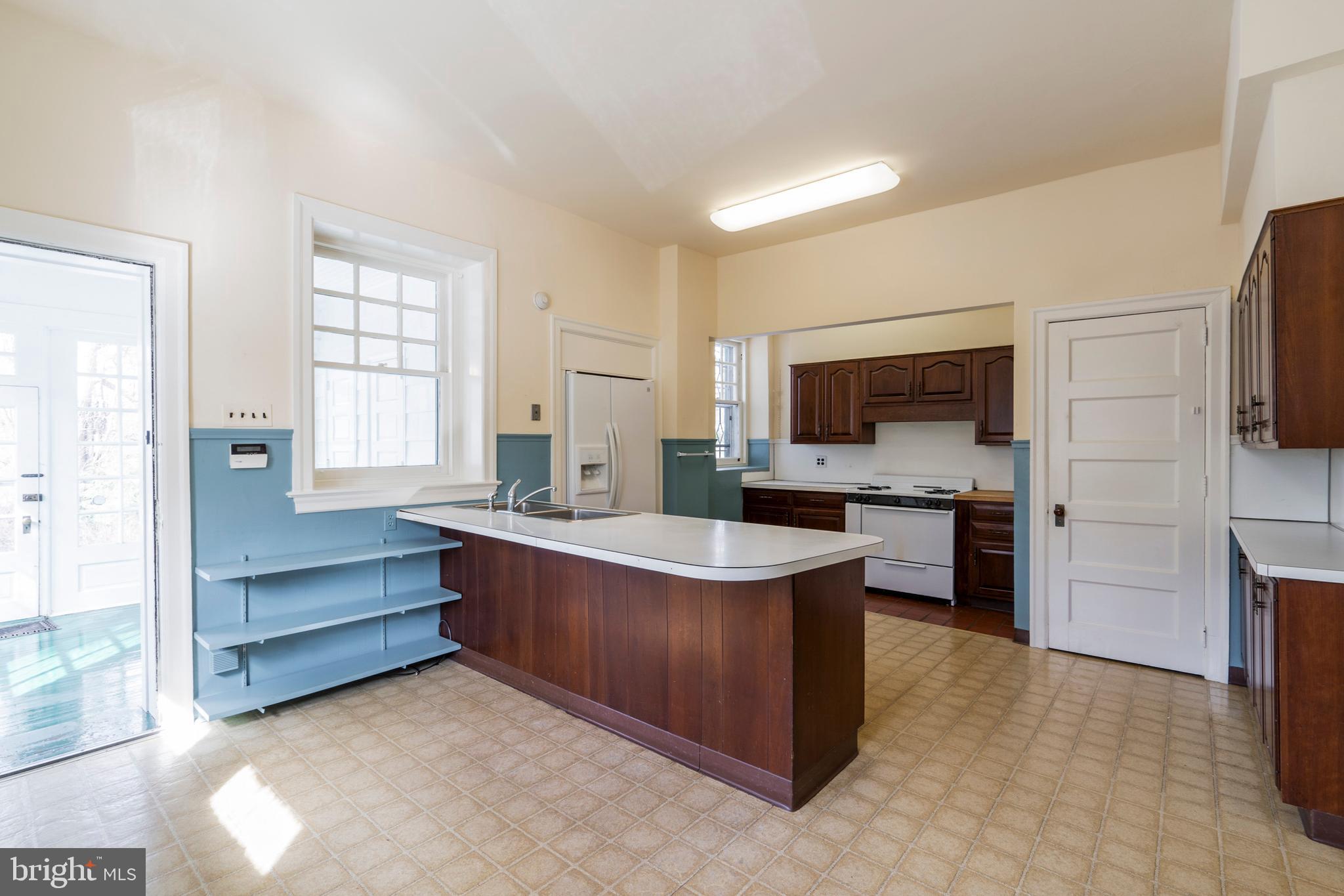 132 St Georges Road Ardmore, PA 19003 - Photo 25 of 87 a kitchen with stainless steel appliances a sink and a refrigerator