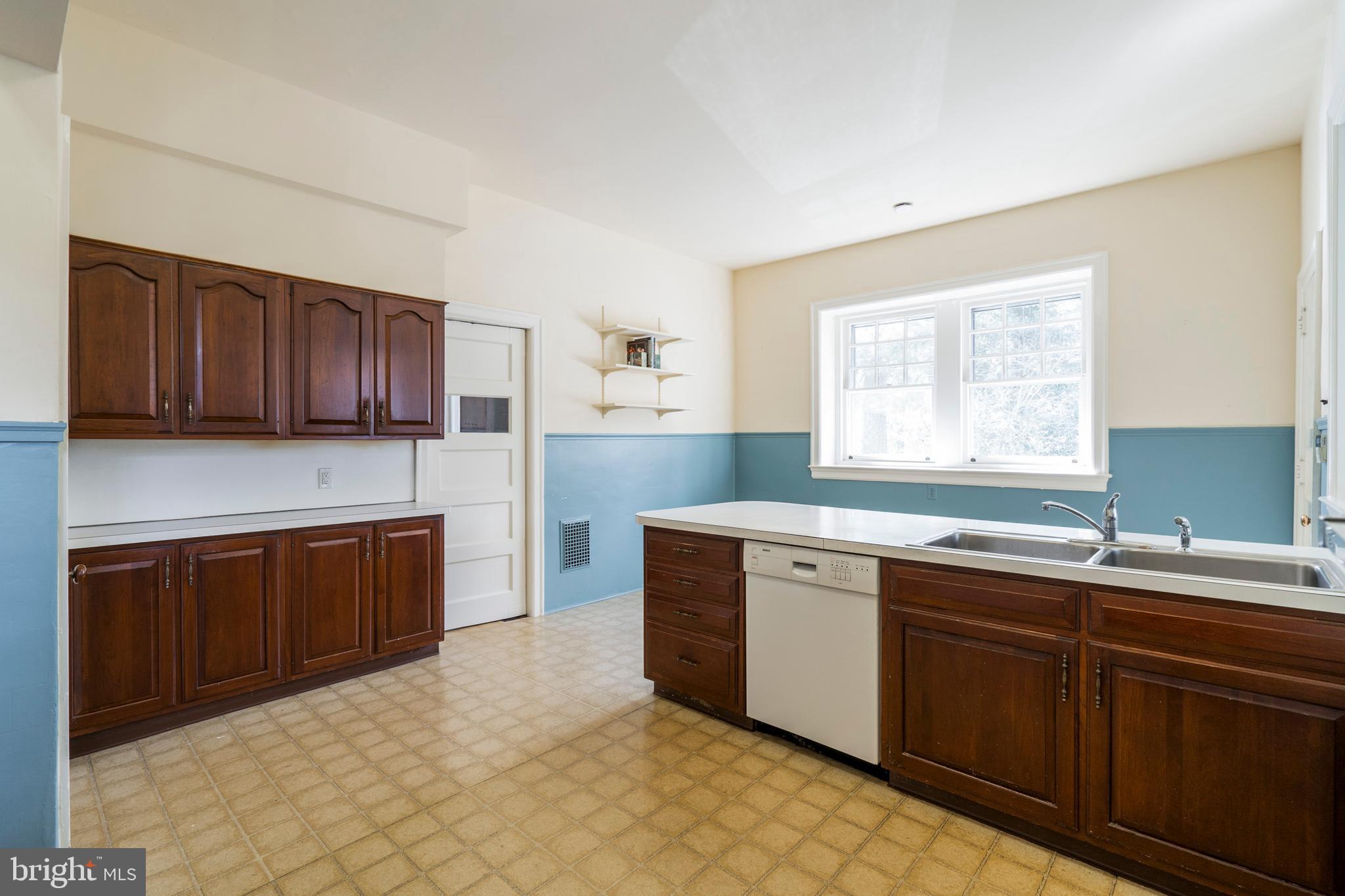 132 St Georges Road Ardmore, PA 19003 - Photo 26 of 87 a kitchen with stainless steel appliances granite countertop a sink and cabinets
