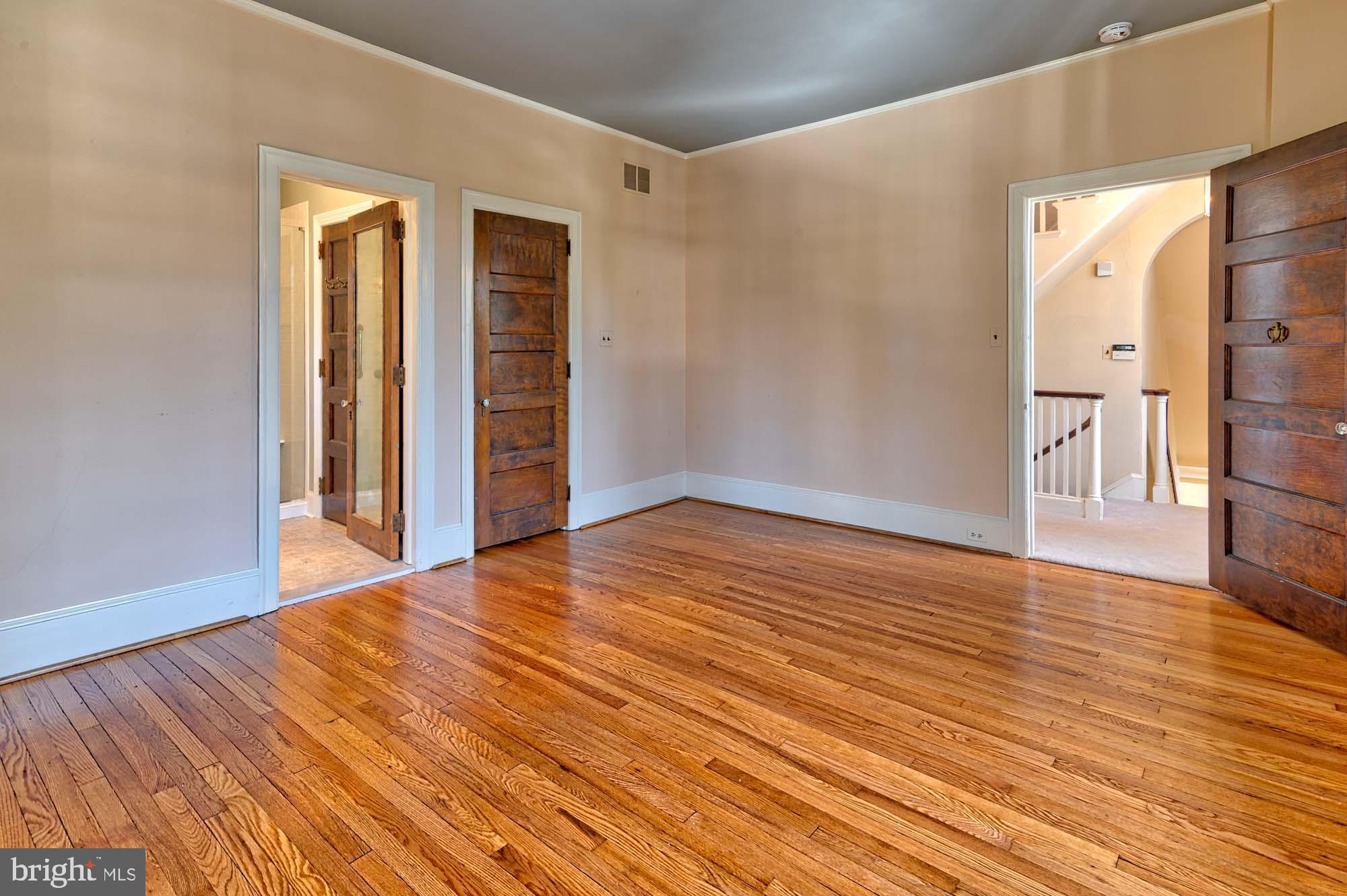 132 St Georges Road Ardmore, PA 19003 - Photo 34 of 87 a view of an empty room with wooden floor and a window
