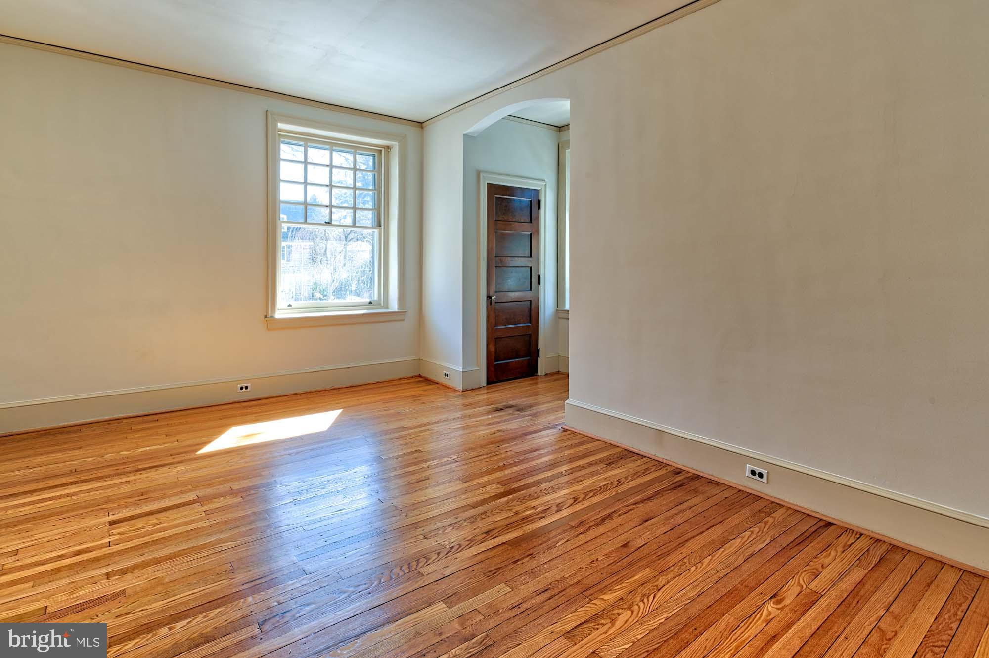 132 St Georges Road Ardmore, PA 19003 - Photo 42 of 87 an empty room with wooden floor and windows
