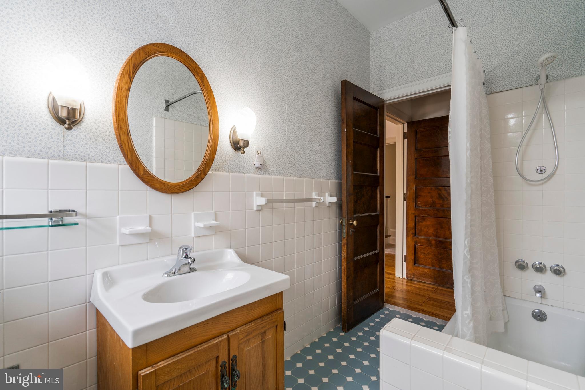 132 St Georges Road Ardmore, PA 19003 - Photo 45 of 87 a bathroom with a sink and a mirror