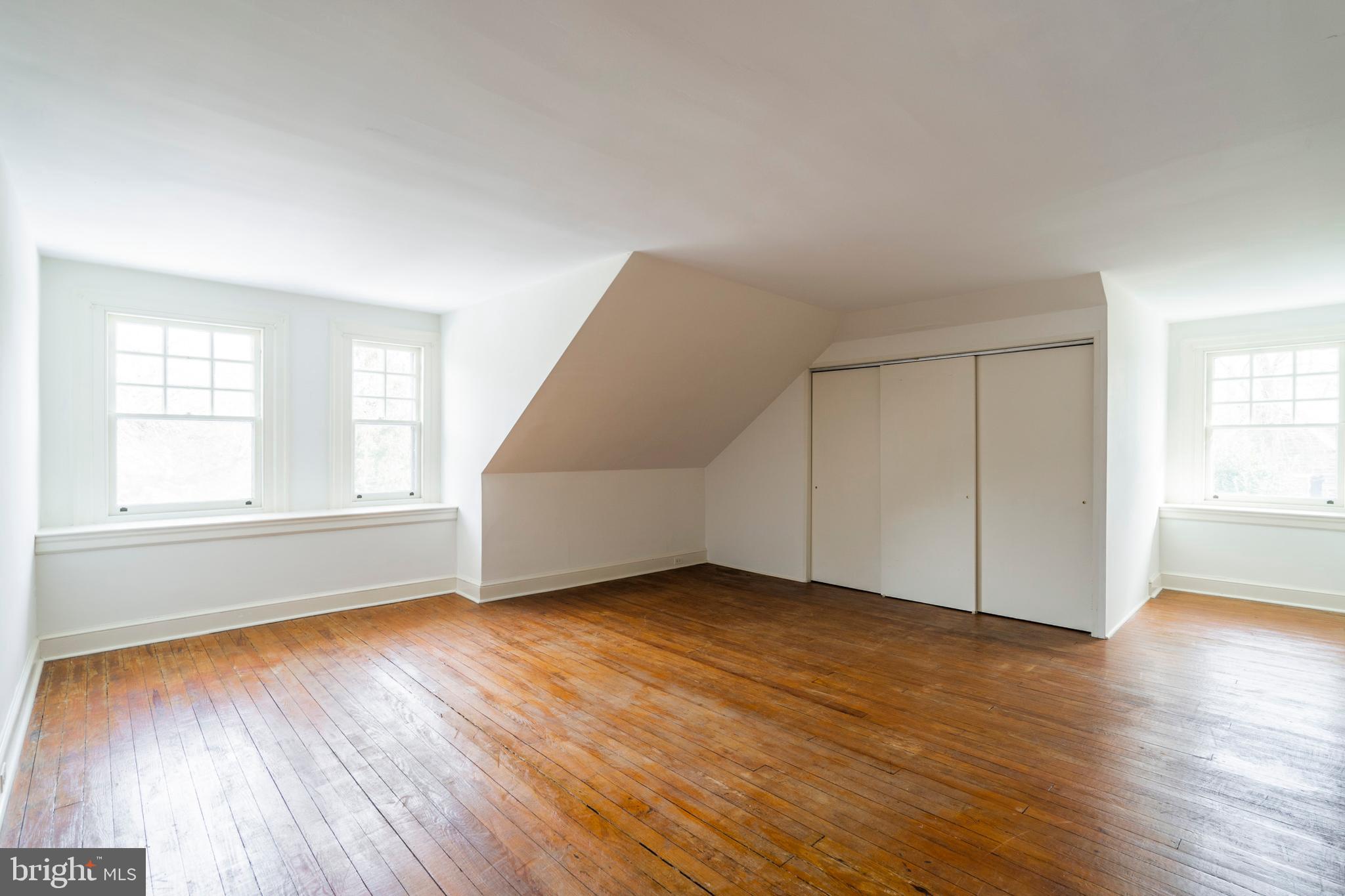 132 St Georges Road Ardmore, PA 19003 - Photo 63 of 87 an empty room with wooden floor and windows