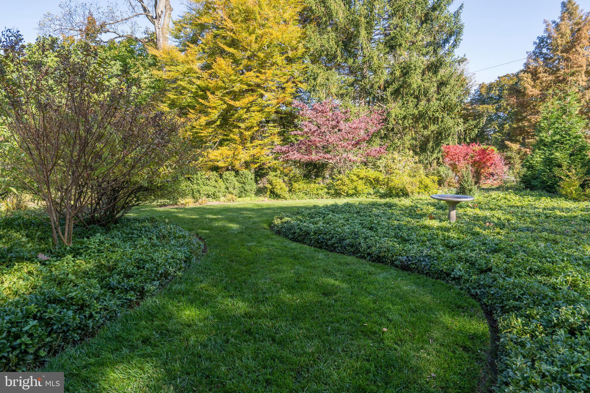 132 St Georges Road Ardmore, PA 19003 - Photo 79 of 87 a backyard of a house with lots of green space and chair