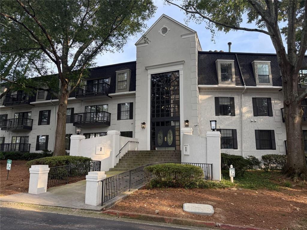 a front view of a house with garage